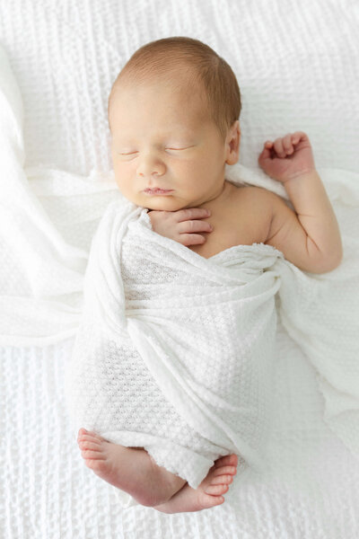 newborn baby wrapped up sleeping for newborn photography