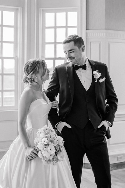 Wedding at the Estate at River Run in Maidens, VA | Wedding Photographer in Richmond | black and white image of bride and groom looking at each other while arm in arm at the Estate at River Run in Richmond