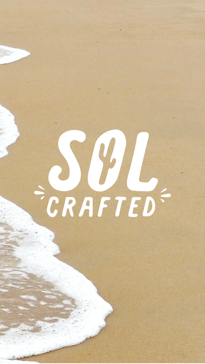 A white logo that spells SOL CRAFTED with a cactus in the O