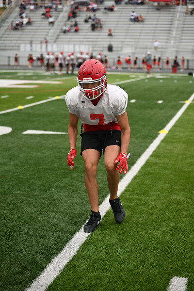 a football player warms up before a game in a sports photo by tristar visuals photography