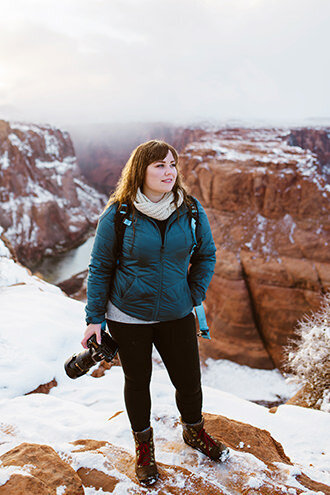 Adventure elopement wedding photographer Julie Haider looks out over Horseshoe Bend