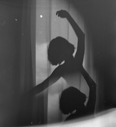 Woman dancing in the shadows