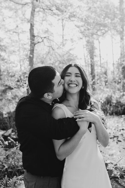 Man kisses woman on the cheek