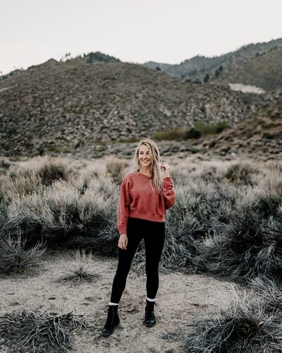 girl laughing in the mountains