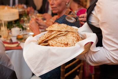 Breads being served to a table