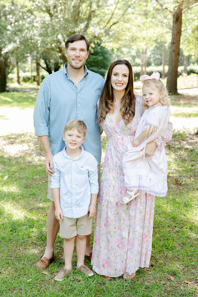 Family of 4 posing together for family photography
