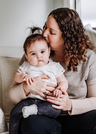 marjorie cohen family photographer kisses her baby