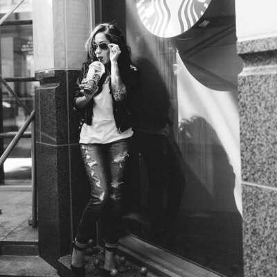 Lynnette sipping on her frapp outside of the Austin Texas Starbucks