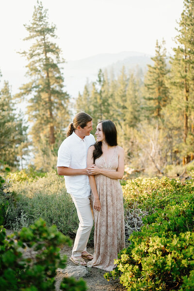 Engaged couple gazes into each other's eyes in lake tahoe
