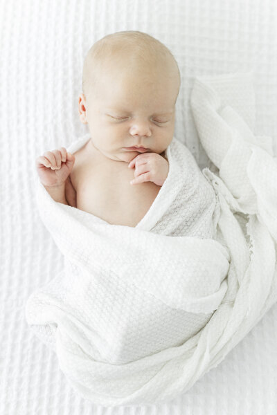 baby eating cake during photography session in Dothan Alabama