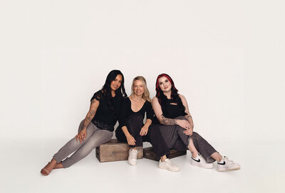 A Langley photography company poses their team in a group shot on a white background.