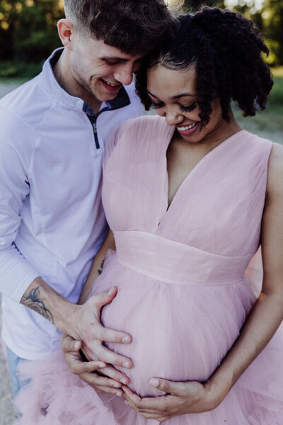 maternity belly with moms hands