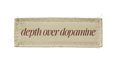 Clothes label reading 'Depth over Dopamine'