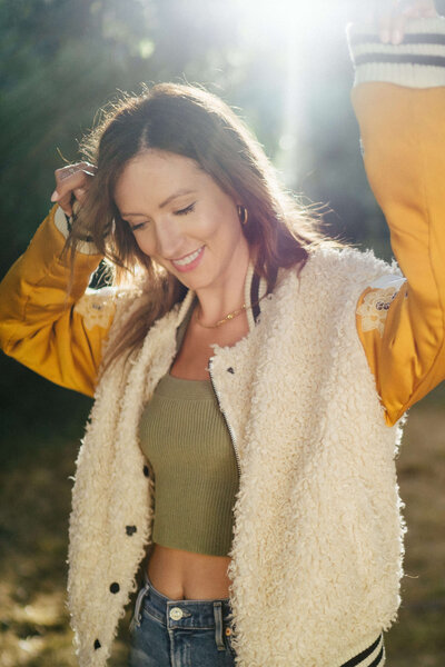 melyssa griffin, outside, dancing in the sun, smiling