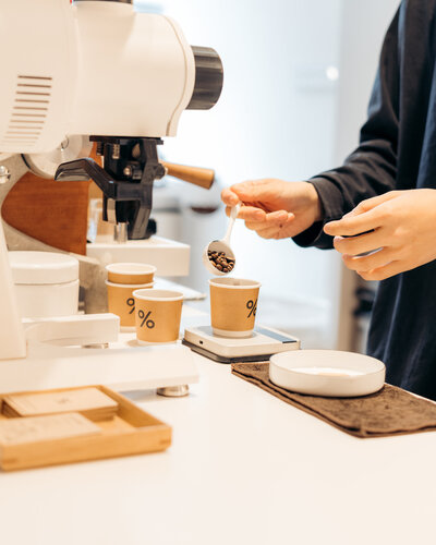 measuring coffee beans in a coffee shop in kyoto, japan