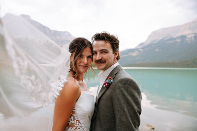 couple kissing in a glacier fed lake