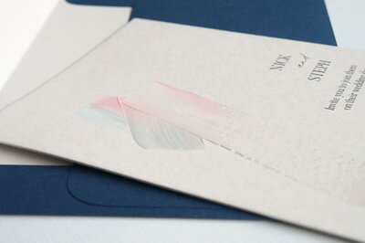 Pink and blue painted wedding invitation with painted stripe and blue envelope