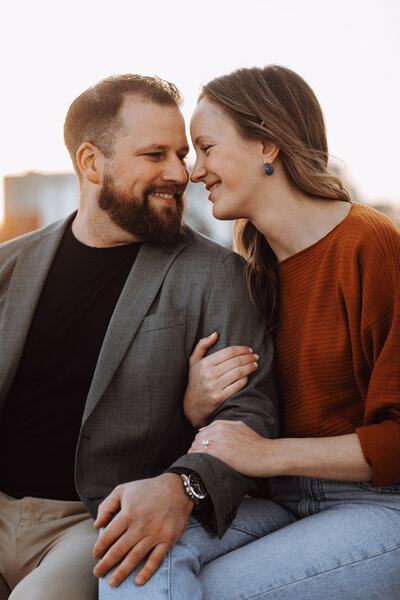 Closeup of a couple snuggling up next to each other during their engagement session