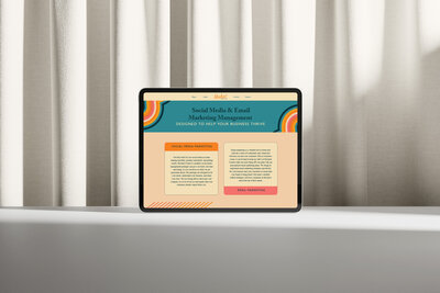 Strategic homepage design by Ruby Works Co.™ displayed on a laptop, featuring bold color blocking and clear, results-oriented messaging.