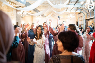 Bride dancing with her guests at the dance floor