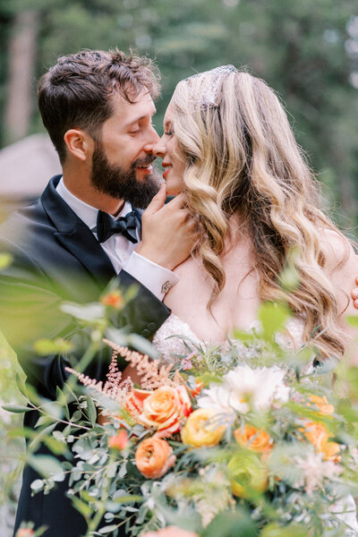 A steamy, romantic fine art portrait of the newlyweds in the lush rose gardens at The Barn at Reynolda Village, beautifully captured by Jessica Leigh Photography.