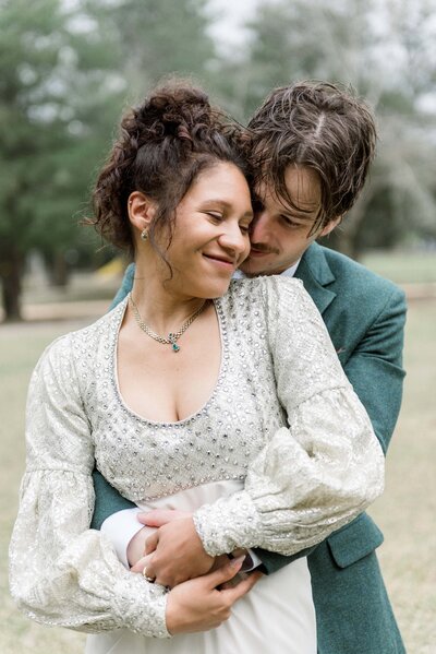 Gulf coast biracial couple pose for their wedding portraits at Adventure Unlimited in Milton, Florida. 