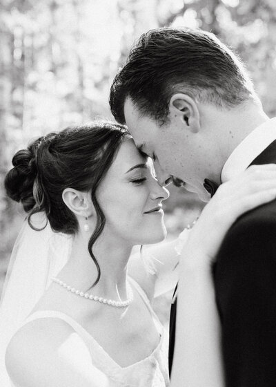 Bride and groom during wedding golden hour portrait session at Payette Lake, McCall, Idaho wedding - photographed by The Storytellers