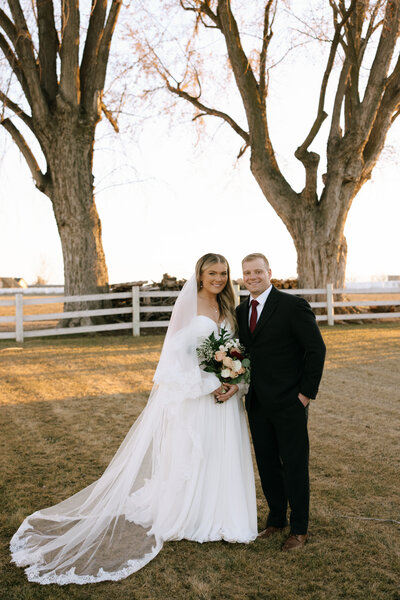 Newlyweds at their wedding reception at White Barn at Happy Valley in Nampa