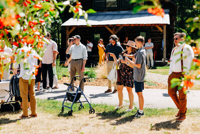 Wedding reception guests mingling at Blackfoot River House in Bonner, MT