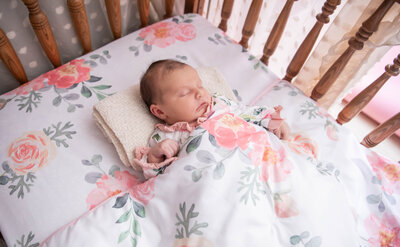 Newborn baby lying in crib | Newborn Photography Session