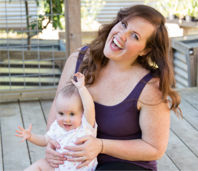 liz winters holding makeup brush and using non-toxic makeup