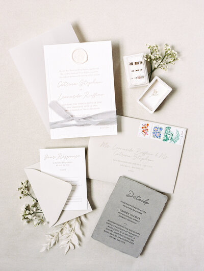 a custom wedding signage design  seating chart with white flowers and babys breath at a luxury alyssa amez design wedding