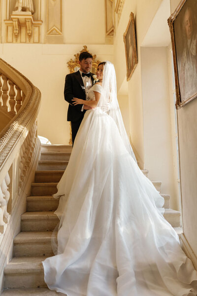 Couple on staircase at Chateau La Durantie wedding in southern France