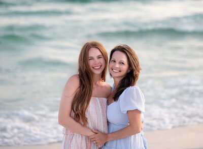 Mother and daughter hugging each other for a professional photo. 