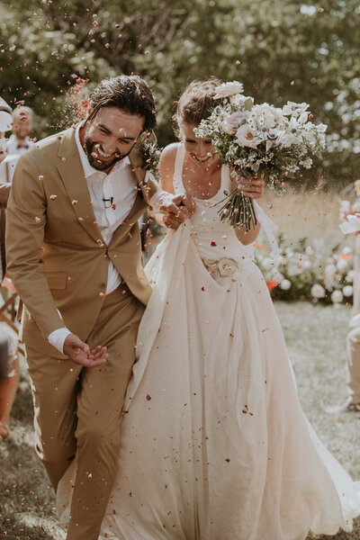 Bride and groom walking down aisle in outdoor ceremony in Woodstock, Ontario