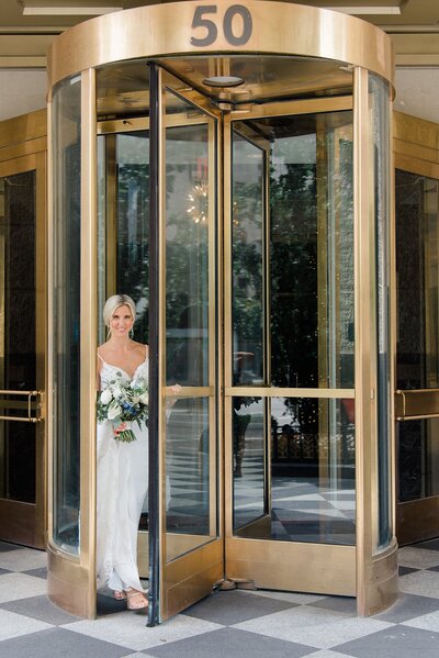 Bride walking out of hotel leveque at Columbus Ohio wedding