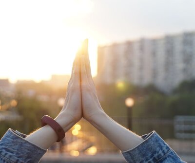 High five between hands, representing continued guidance, celebration, and connection on the healing journey
