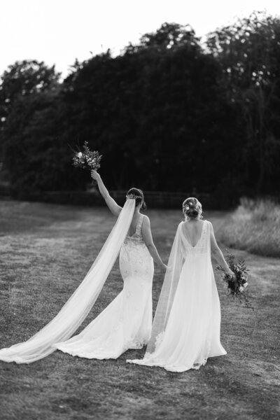 two brides during same sex wedding having romantic photoshoot in black and white