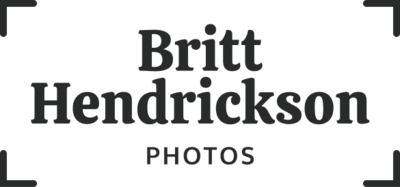 The words "Britt Hendrickson Photos" are center-aligned in camera framing marks. The logo is black.