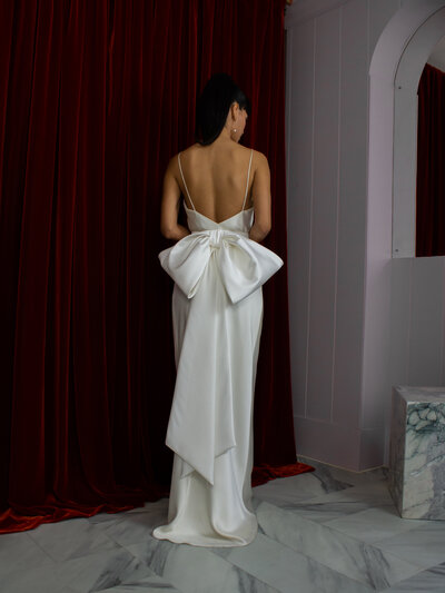 black and white image bride wearing feathered wedding dress