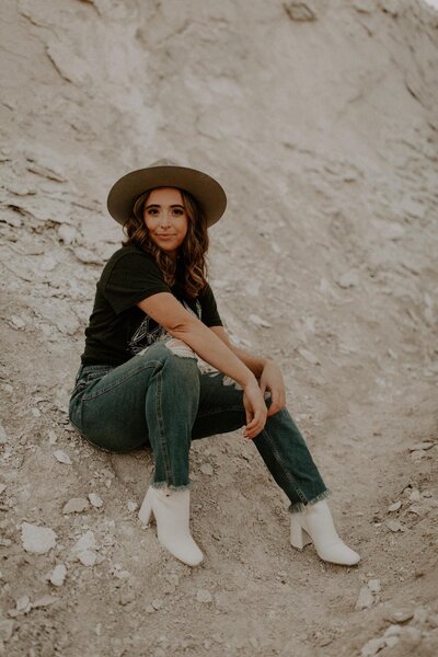 Brittany sitting in the sand