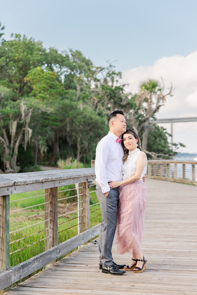 couple snuggling by the water Charleston