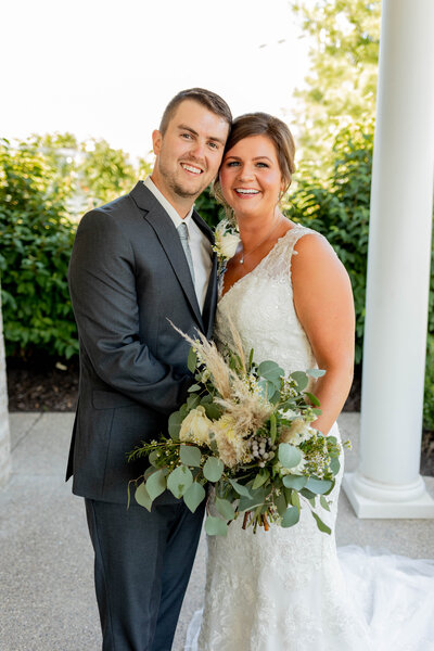 bride and groom smiling