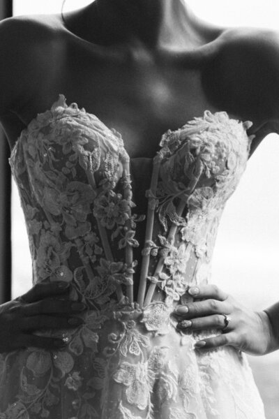 bride-in-a-peach-wedding-gown-sitting-in-a-chair