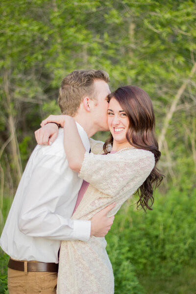Idaho Wedding Photographer captures spring engagements of couple kissing