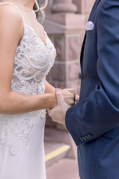 Bride and groom holding hands