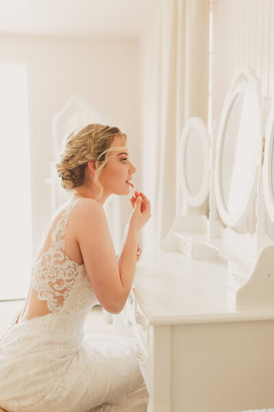 Bride getting ready for her wedding in Logan, Utah at the American West Heritage Center