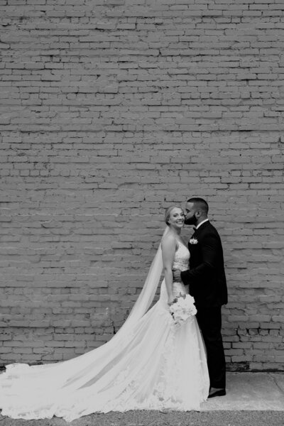 A Bride and Groom pose for their wedding day photos with Vibe Studio SA in San Antonio, Texas.