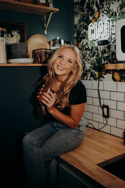 A Hawaii photographer sitting on a kitchen counter