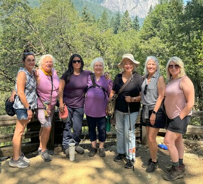 Samarah Grace and women smiling while hiking on reiki retreat